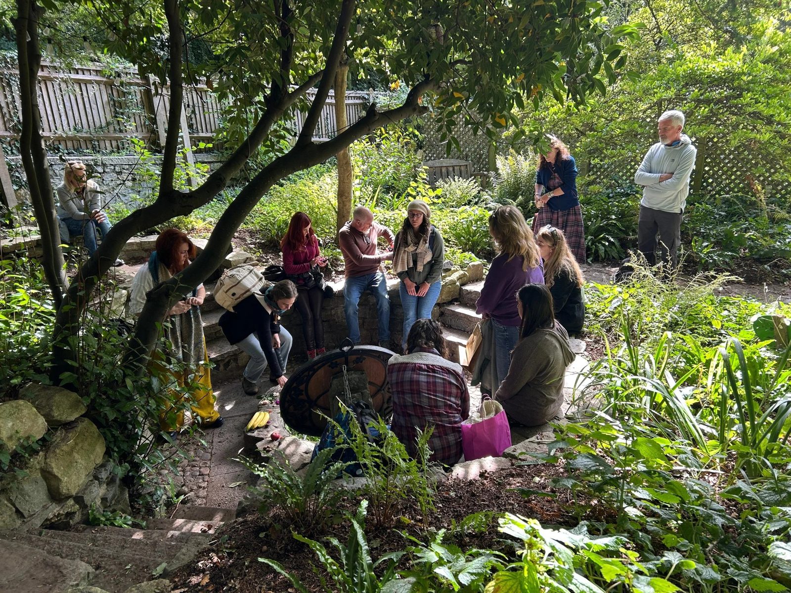 Pilgrimage circle gathered at Chalice Well in England