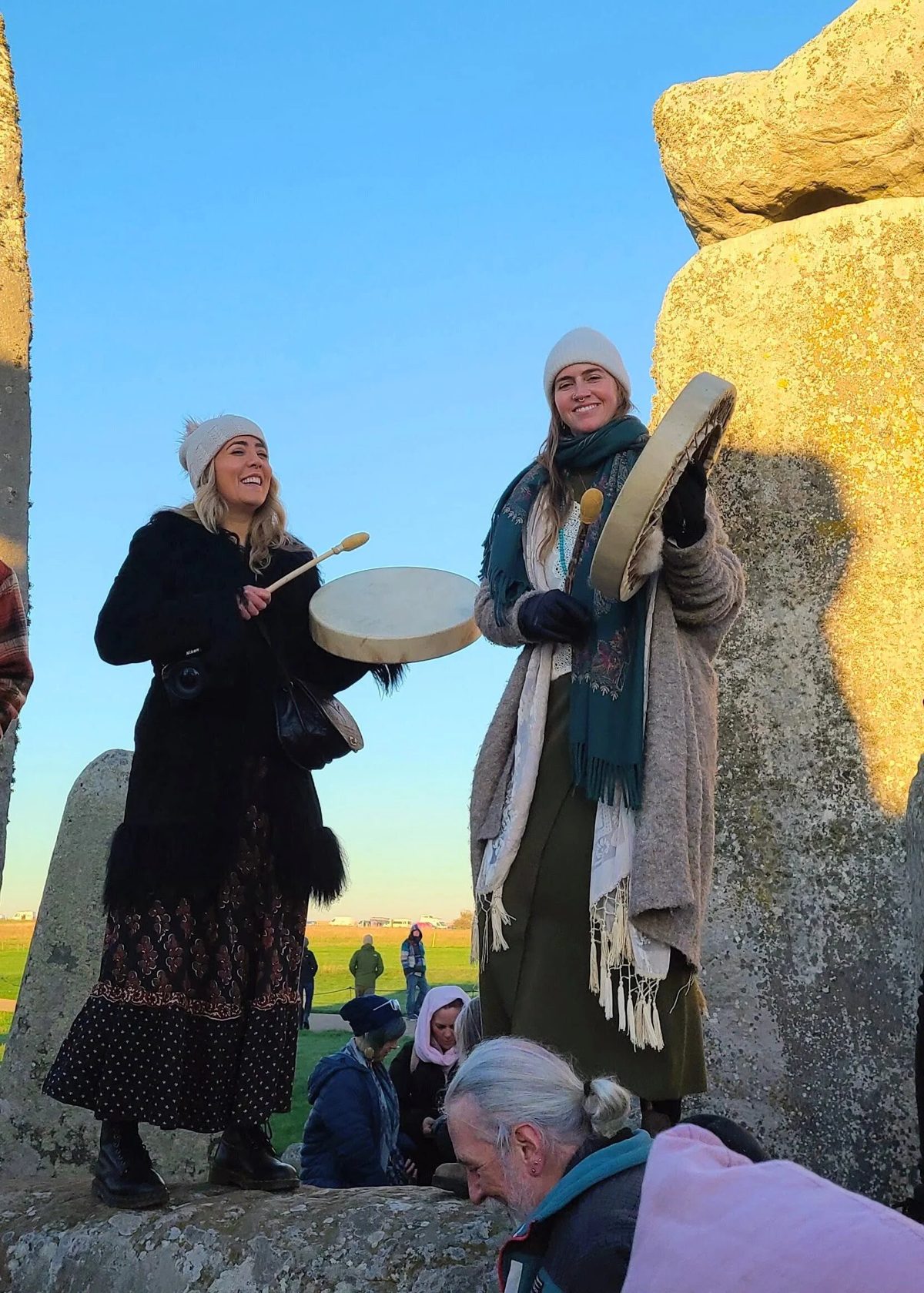 Hannah and Lizzie drumming together during the 2025 England pilgrimage